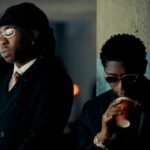FOLA performing alongside Bella Shmurda and Zlatan in the official music video for it's over.