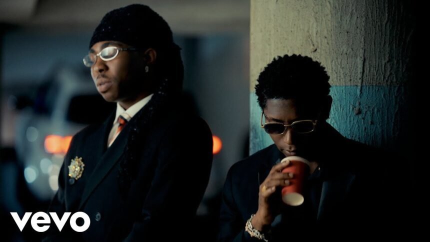 FOLA performing alongside Bella Shmurda and Zlatan in the official music video for it's over.